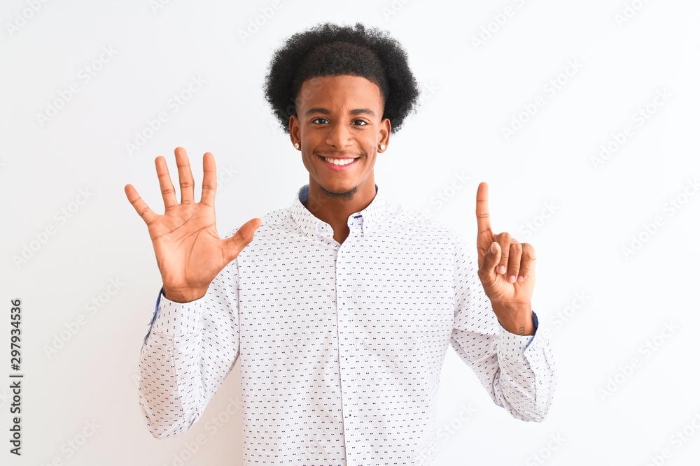 Young african american man wearing elegant shirt standing over isolated white background showing and pointing up with fingers number six while smiling confident and happy. Young african american man wearing elegant shirt standing over isolated white background showing and pointing up with fingers number six while smiling confident and happy.