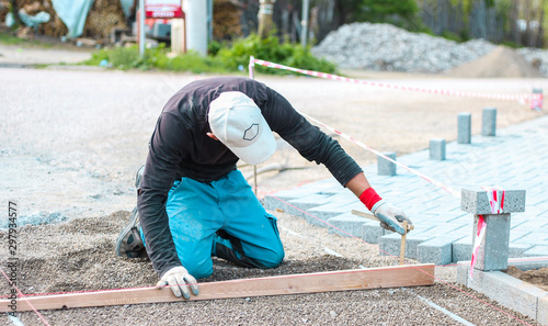 worker brick flooring outdoor (patio, construction)