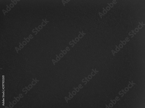 Dark grainy texture. Black foam rubber background