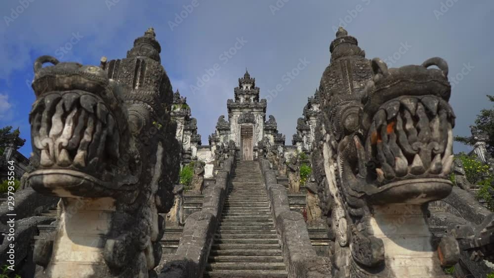 Slowmotion handheld shot of stone dragons guarding the stairs in the Pura Lempuyang Temple at the Bali island, Indonesia Slowmotion handheld shot of stone dragons guarding the stairs in the Pura Lempuyang Temple at the Bali island, Indonesia