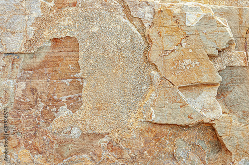 Stone texture. Natural stone close-up. Stone old wall. Structural surface close-up. Granite natural surface. Texture pattern.
