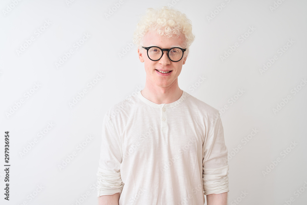 Young albino blond man wearing t-shirt and glasses standing over isolated white background with a happy and cool smile on face. Lucky person. Young albino blond man wearing t-shirt and glasses standing over isolated white background with a happy and cool smile on face. Lucky person.