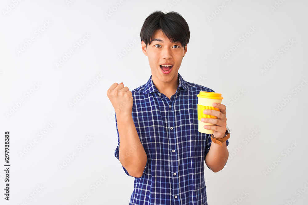 Young chinese man drinking take away coffee standing over isolated white background screaming proud and celebrating victory and success very excited, cheering emotion Young chinese man drinking take away coffee standing over isolated white background screaming proud and celebrating victory and success very excited, cheering emotion