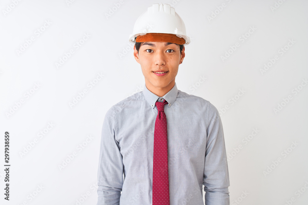 Chinese architect man wearing tie and helmet standing over isolated white background with a happy and cool smile on face. Lucky person. Chinese architect man wearing tie and helmet standing over isolated white background with a happy and cool smile on face. Lucky person.