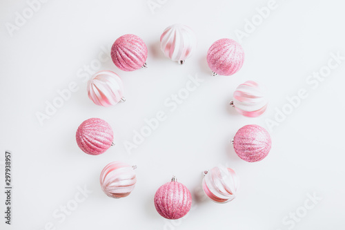 Wreath made of Pink Christmas Balls on white background. Top view. Copy space. Flat lay. Christmas minimal concept.