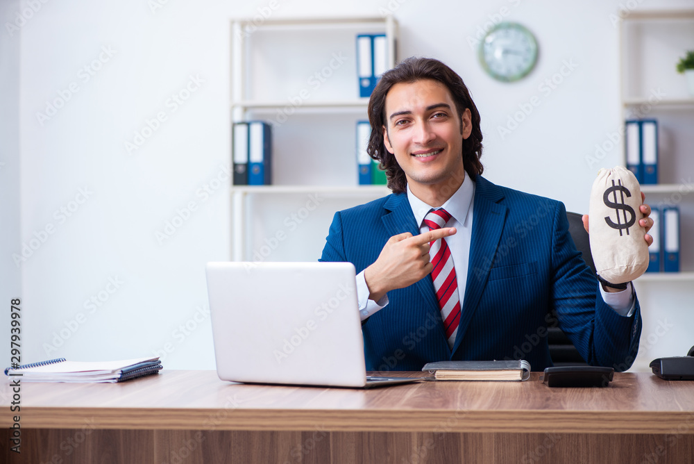 Young male businessman working in the office