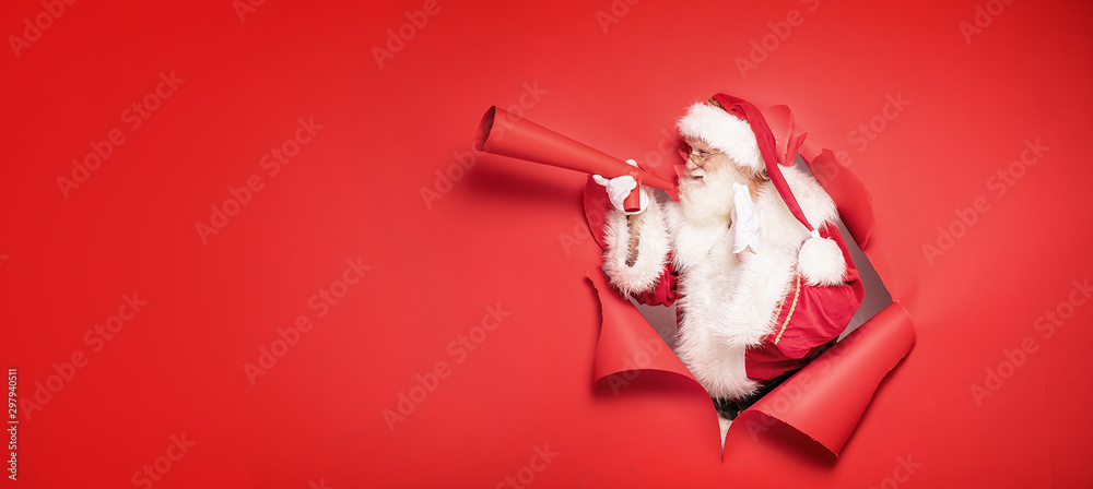 Santa Claus screaming by megaphone. - obrazy, fototapety, plakaty 