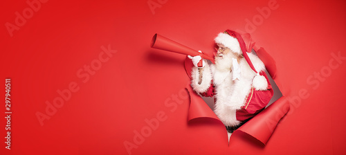 Santa Claus screaming by megaphone.