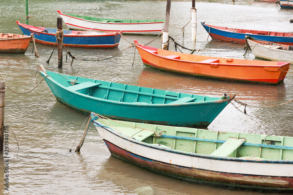 Colorful wooden boats for fishing in the sea of Ribeiro beach in Vila Velha Espírito Santo Brazil