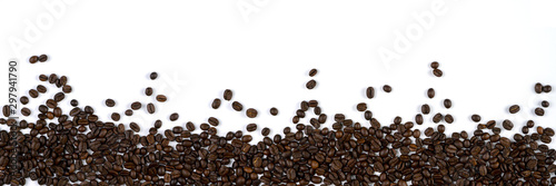 beverage background of roasted coffee beans scattered isolated around on white background