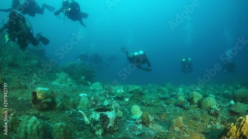 Wallpaper Mural Divers in Truk Lagoon of shipwreck on Chuuk Islands. Shipwreck in historic place of tragedy of WW II and diving among wreckage of ship. Torontodigital.ca