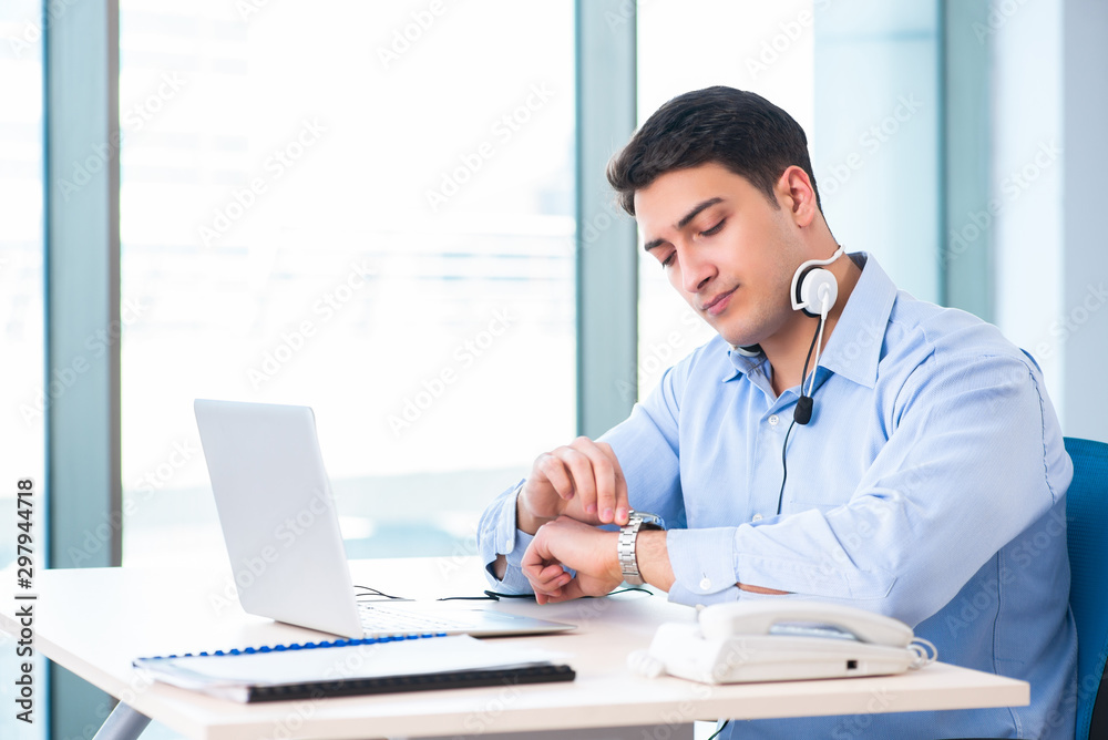 Male call-center operator in business concept Male call-center operator in business concept