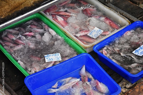 Maeklong railway street fish market by Bangkok Thailand. Street marine market where train passes daily. Sale of fresh fish. Freshly caught fish. Asian cuisine, Seafood, Fisherman. Catch. Fresh food. A