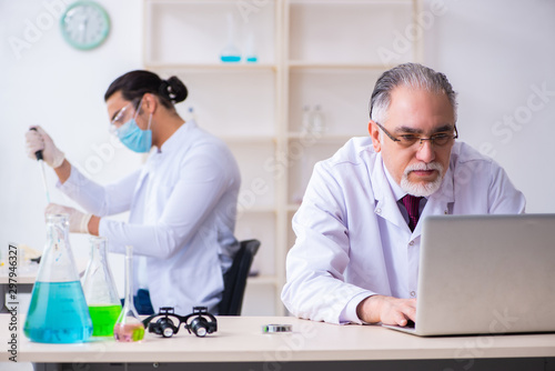 Two chemists working in the lab