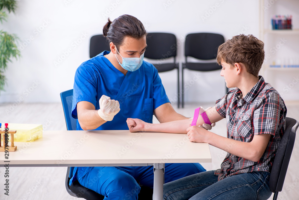 Young boy visiting doctor in hospital