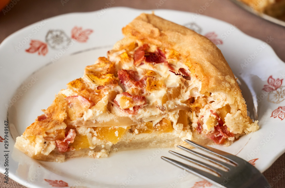 Piece of quiche with pumpkin and tomatoes Piece of quiche with pumpkin and tomatoes