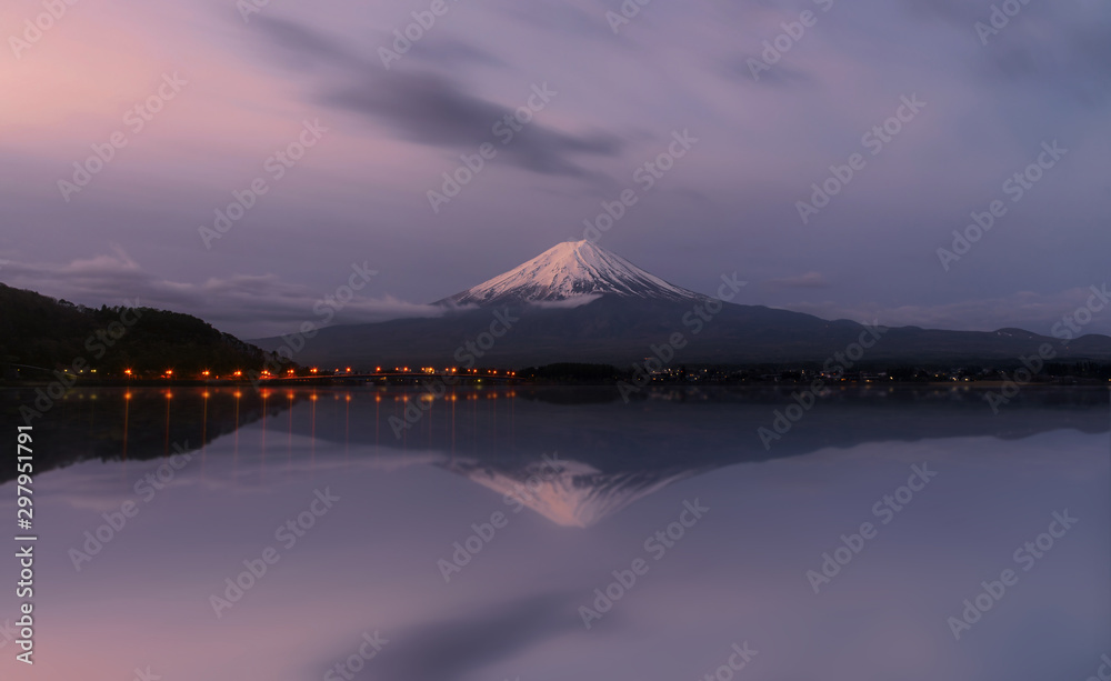 Fuji mountain and reflection in early morning at lake Kawaguchiko, Japan.