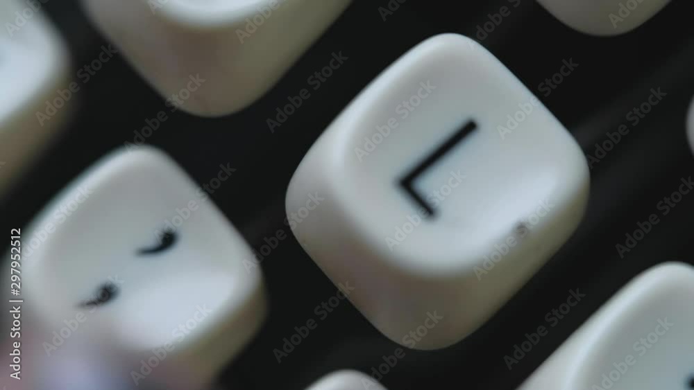 Extreme close up on caucasian woman hands with grey nails typing on typewriter Extreme close up on caucasian woman hands with grey nails typing on typewriter