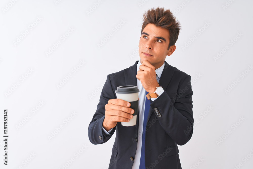 Young handsome businessman wearing suit holding coffee over isolated white background serious face thinking about question, very confused idea Young handsome businessman wearing suit holding coffee over isolated white background serious face thinking about question, very confused idea
