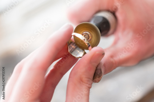 Close-Up Of Repairing Ring By Polishing Motors Tool