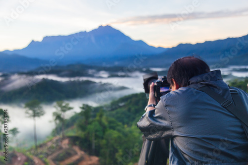 Wallpaper Mural Asia Photographer man taking picture of beautiful Mount Kinabalu, Sabah, Borneo with nature environment  Torontodigital.ca