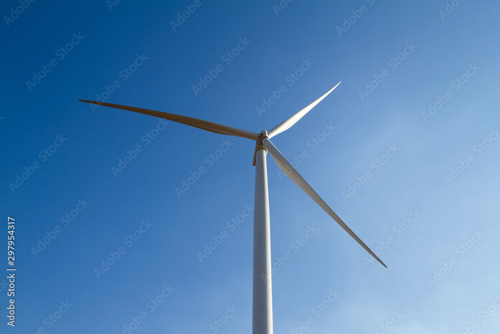 Power of wind turbine generating electricity clean energy on blue sky Power of wind turbine generating electricity clean energy on blue sky
