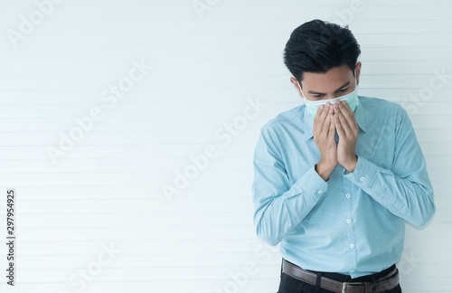 Young men wear surgical masks to protect them from dust and germs from coughing and sneezing.White isolated for background .