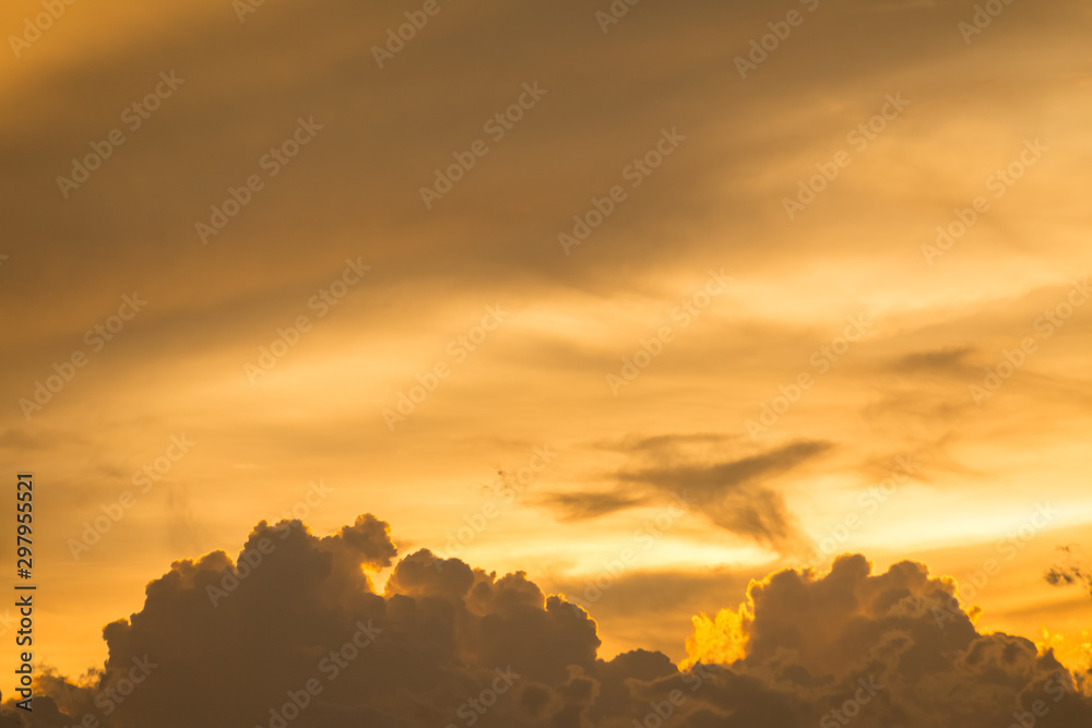 Golden sky and clouds before sunset