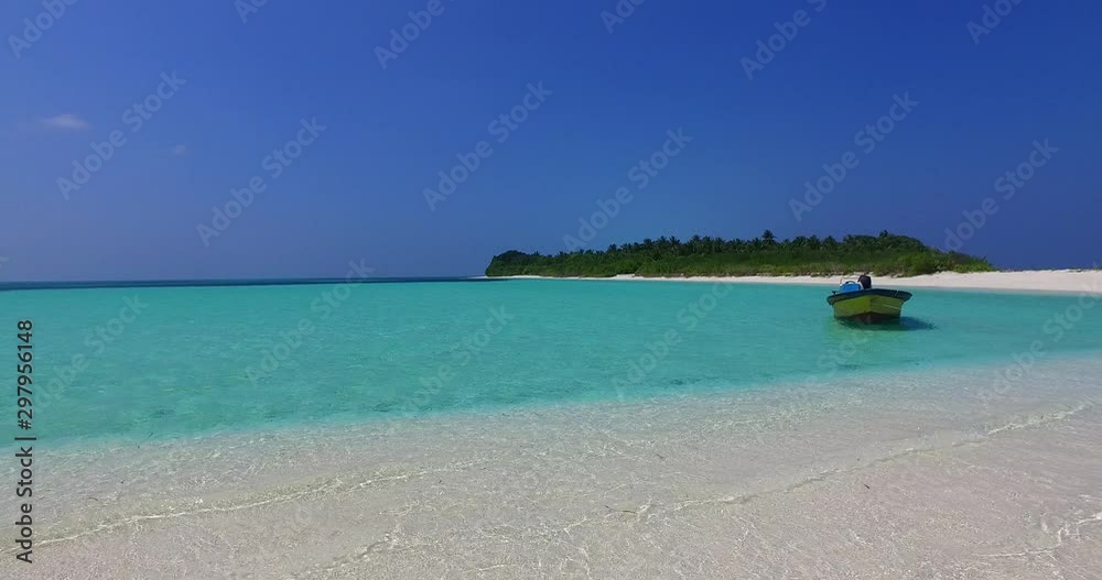 astonishing white sand turquoise sea water background with moored small fishing boat on the shore astonishing white sand turquoise sea water background with moored small fishing boat on the shore