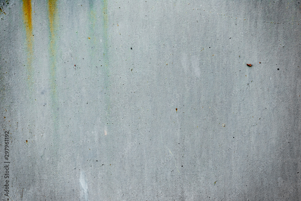 Fototapeta premium Texture of a concrete wall with cracks and scratches which can be used as a background