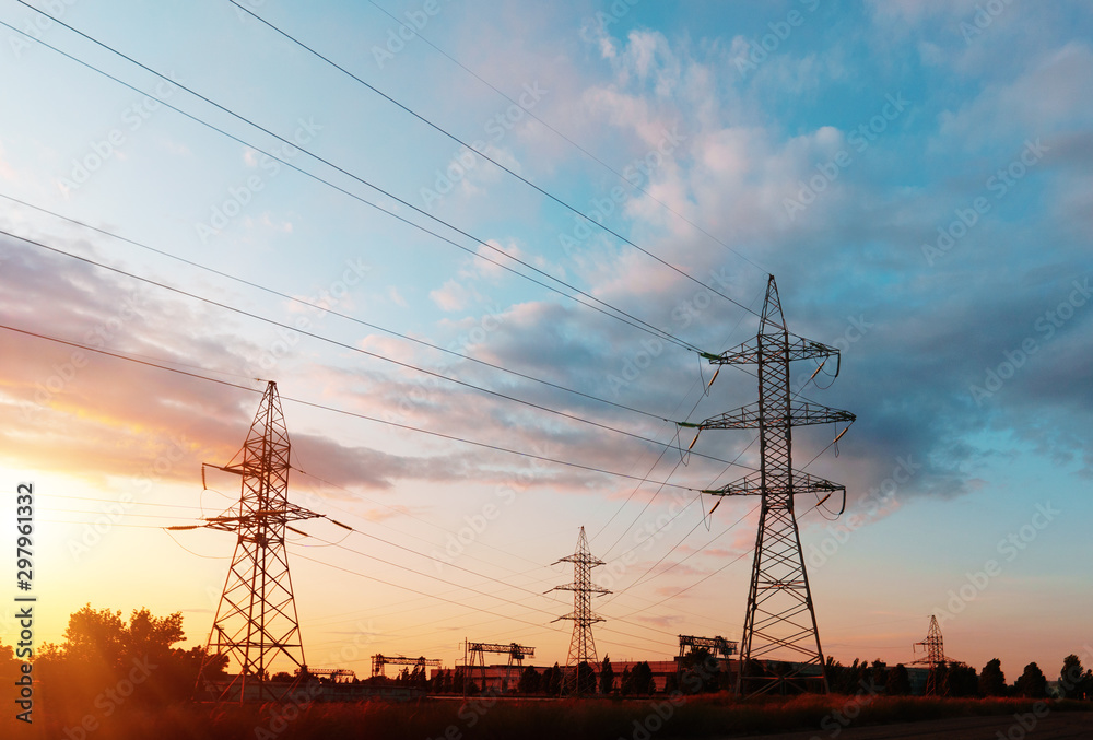Fototapeta premium Electrical substation silhouette on the dramatic sunset background