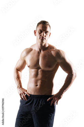 Strong, fit and sporty bodybuilder man over white background. Sport and fitness.