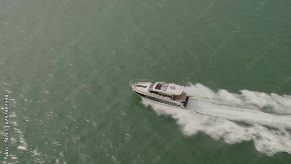 Aerial, motorboat, yacht calm and relaxing. Luxury powerboat cutting through the water. Southampton, 30ft boat Aerial, motorboat, yacht calm and relaxing. Luxury powerboat cutting through the water. Southampton, 30ft boat