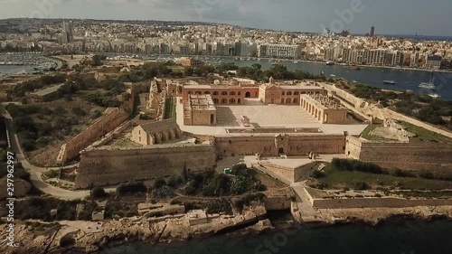 Aerial view fo Fort Manoel, Malta. Made famous by Game of Thrones and Assassin's Creed. Front view with city background. photo