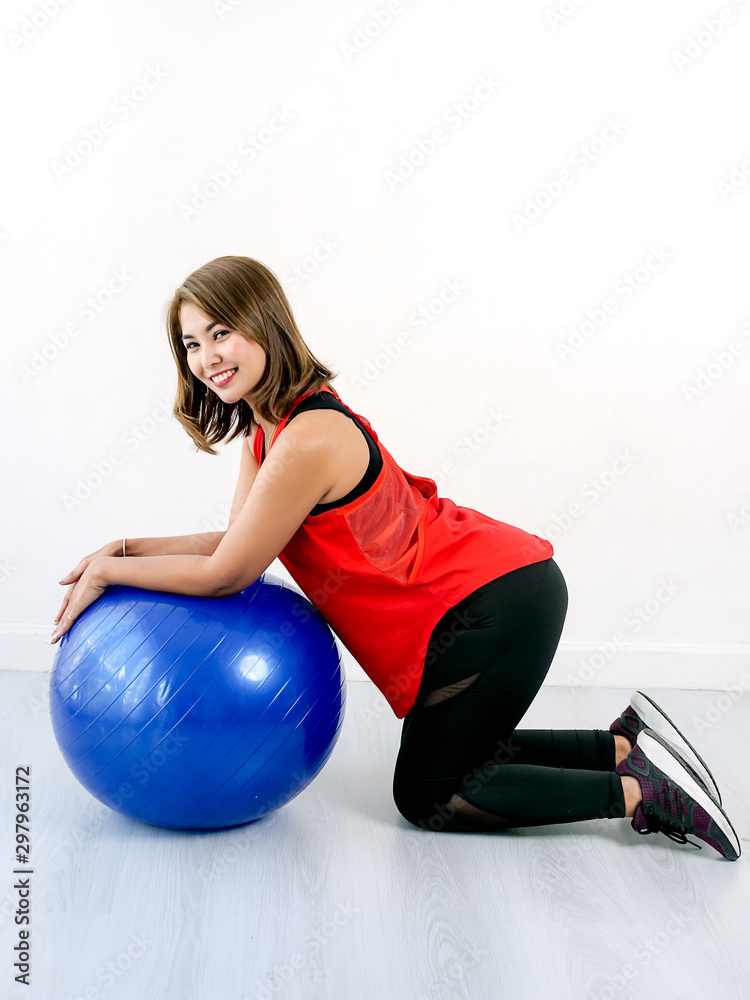 Asian sport woman exercise on blue ball pilates, lifestyle concept.. Asian sport woman exercise on blue ball pilates, lifestyle concept..