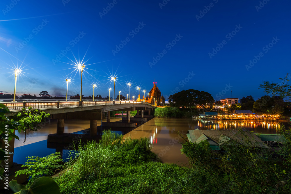 Fototapeta premium The color of Night traffic light on the road on the bridge (Suphankanlaya Bridge) in Phitsanulok, Thailand.