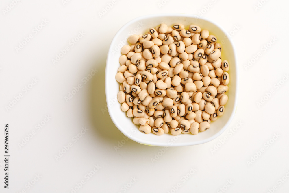 Black eyed seeds or chawali seeds in glass bowl on white background Black eyed seeds or chawali seeds in glass bowl on white background