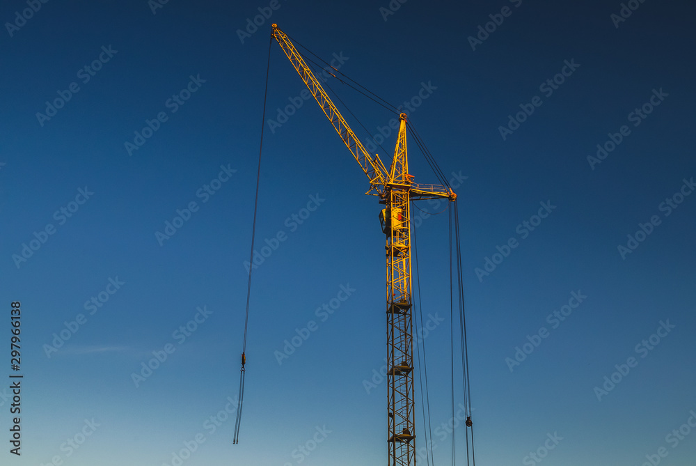 Construction crane on a background of blue sky. Construction crane on a background of blue sky.