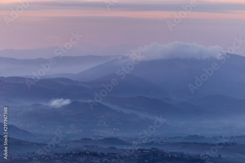 A view of Umbria valley with hills and mist