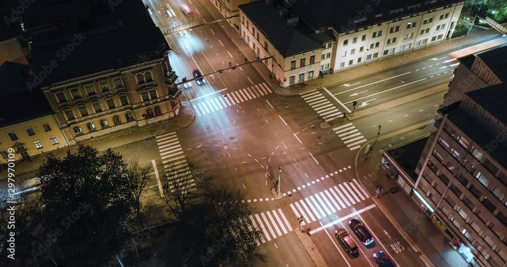 Aerial time-lapse of fast moving traffic in intersection at night Aerial time-lapse of fast moving traffic in intersection at night