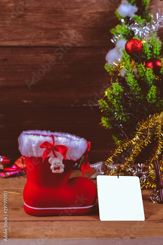 White bank card with christmas decoration on rustic wooden table Christmas background.