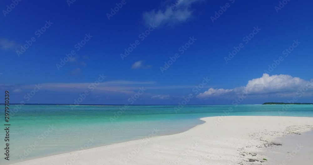 Idyllic wide panorama of endless Pacific ocean from a white sandy beach, navy blue sky with big hanging clouds Idyllic wide panorama of endless Pacific ocean from a white sandy beach, navy blue sky with big hanging clouds
