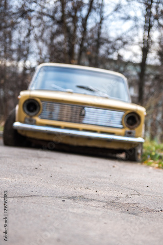 old abandoned broken yellow car