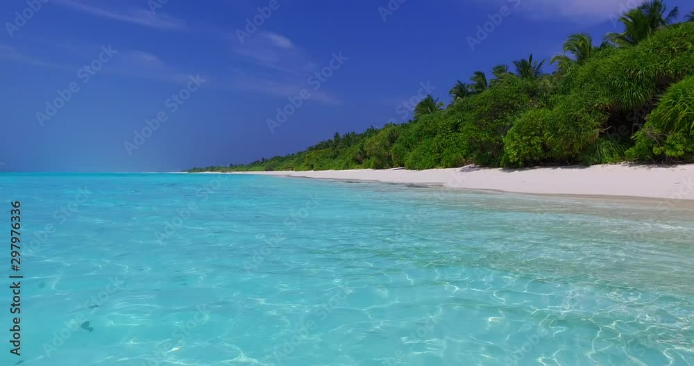 Clear Tropical Lagoon in the Maldives, with green bushes on the white beach Clear Tropical Lagoon in the Maldives, with green bushes on the white beach