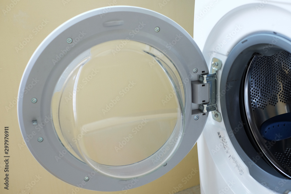Opening the front-loading washing machine door. Opening the front-loading washing machine door.