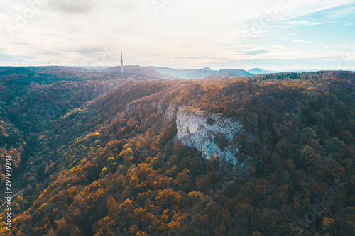 Aerial view of a white rock and forest in autumn © Timo Günthner