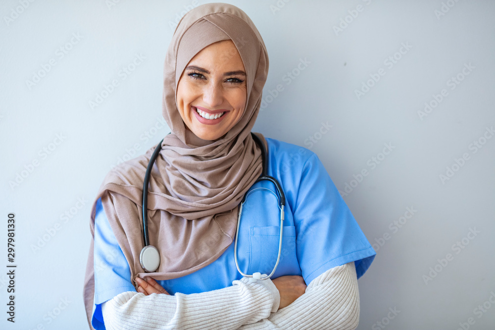 Confident Muslim female doctor standing inside hospital. Portrait of Muslim Doctor with