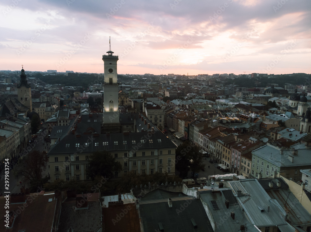 aerial view of lviv bell clock tower on sunset overcast sky