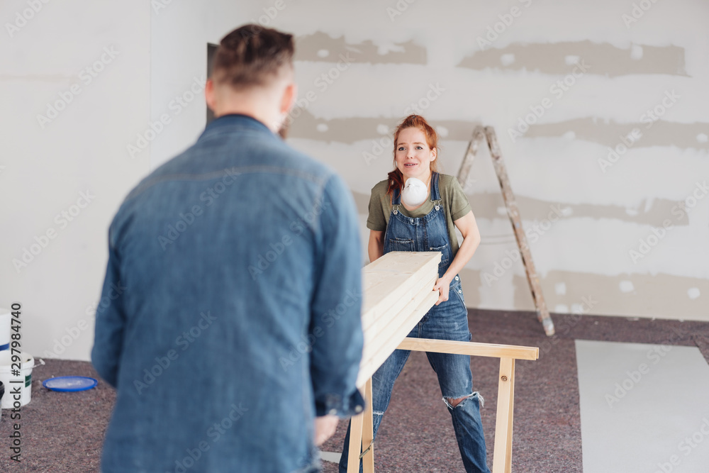Hardworking young couple doing DIY renovations Hardworking young couple doing DIY renovations