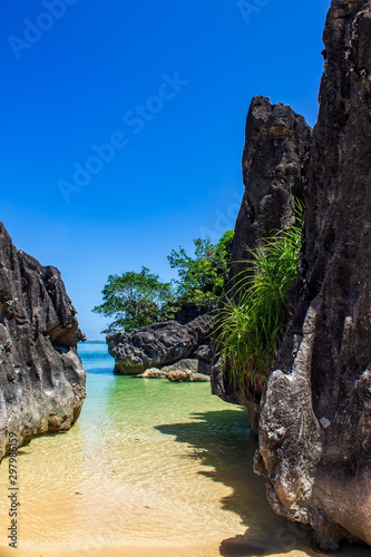 Limestone large rocks on Bagieng Island beach, Caramoan, Camarines Sur Province, Luzon in the Philippines. Vertical view.
